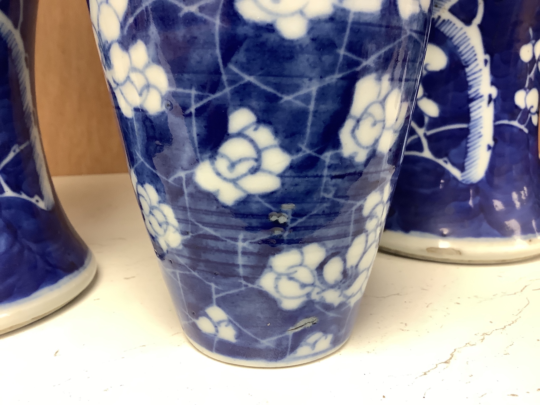 A pair of late 19th century Chinese prunus blossom baluster vases, 30cm, and a Japanese ovoid vase